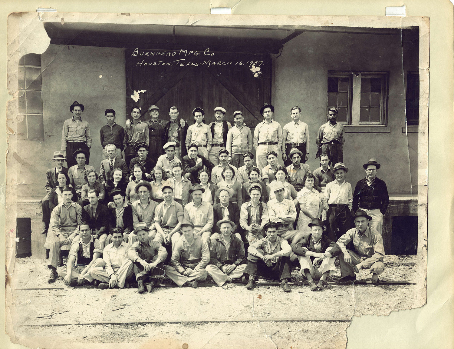 Photo from 1937 showing employees of the Burkhead Manufacturing Company outside their building in Houston Tx